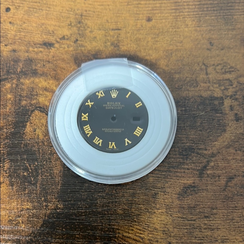Rolex Black Watch Dial with Gold Roman Numerals